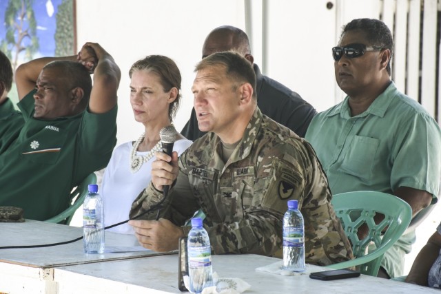 Col. Jeremy Bartel, USAG-KA commander, presents opening remarks at a June 1, 2020 town hall meeting on Ebeye with U.S. Ambassador to the Republic of the Marshall Islands Roxanne Cabral, center. (U.S. Army photo by Jessica Dambruch)