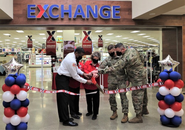 AAFES employees are joined by Garrison Commander Col. C.J. King, Garrison Command Sgt. Maj. William Fogle, and Fort Knox Fire Department Lead Fire Inspector Andre Cornwall for the Exchange grand reopening ribbon cutting.
