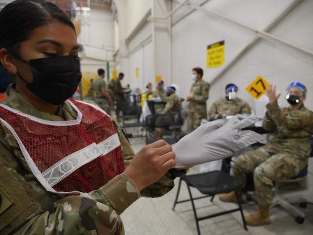 Soldiers prepare to administer the COVID-19 vaccine on February 22, 2021 at the new Fort Sam Houston Vaccine Site located at the Training Support Center, Building 4110, 2536 Garden Avenue, Joint Base San Antonio-Fort Sam Houston. The U.S. Army Medical Center of Excellence will provide augmented support to Brooke Army Medical Center (BAMC) with several dozen vaccinators, screeners, medical administrators, and medical providers at any given time on a rotational basis in support of the tasking that could last up to six months. Augmenters, that include medical military occupational specialties like Combat Medics (68W), Practical Nursing Specialists (68C), and Army Physician Assistants (65D), were given training by BAMC staff on the proper screening, preparation and vaccine administration procedures in advance of the tasking.