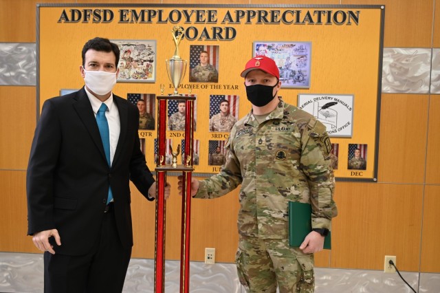 Sgt. 1st Class Shane McGonigle, an instructor at Fort Lee's Quartermaster School, was recognized by Mr. Jason Hanifin, director of the Army Aerial Delivery and Field Services Department, as the Employee of the Year in a Feb. 22 ceremony in Fort Lee, Va.