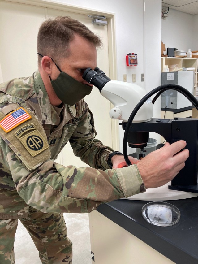 Capt. John Eads, chief of entomology for Public Health Command-Pacific in Japan, examines a vector sample in a microscope at Camp Zama, Japan, Feb. 25, 2021. This spring, Eads and his team will launch the first ever Pre-Exercise Vector...