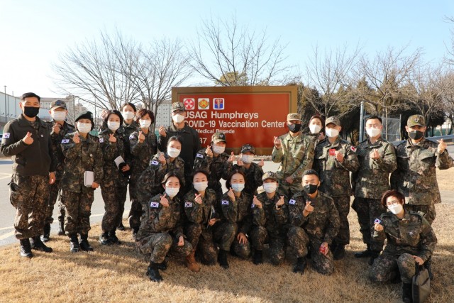 Col. Huy Luu, 549th HC/BDAACH Commander, ROK Army Surgeon General and ROKA Medical Command Personnel and ROKA Integrated Service of Republic of Korea Military Health Care Personnel Program nurses are posing for a picture after the tour of the COVID Vaccination Center