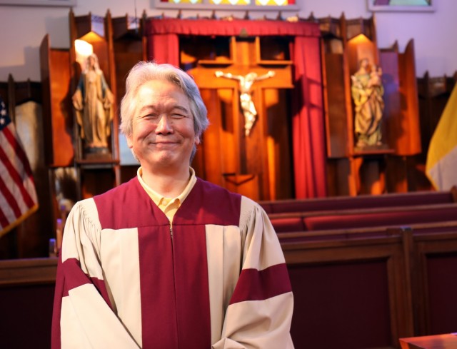 Shunji Sakita, director of the choir for the Holy Family Catholic Community, poses for a photo before Mass at the Camp Zama Chapel, Camp Zama, Japan, Feb. 21.