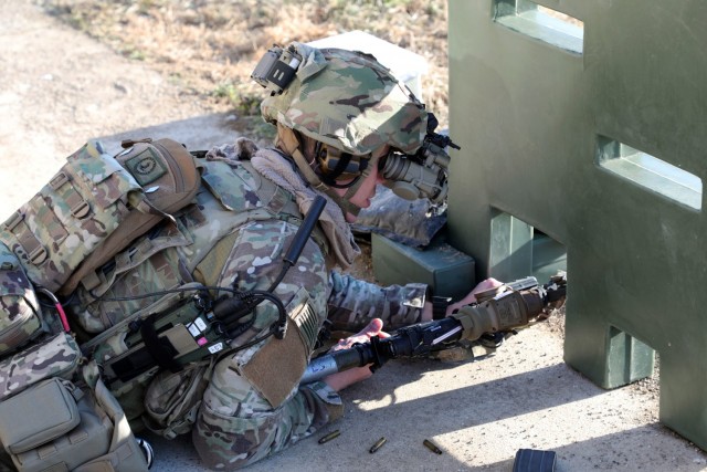 A Soldier from the 2-506, 101st Airborne Division uses the Enhanced Night Vision Goggle (ENVG-B), Nett Warrior, and Family of Weapons Sight – Individual (FWS-I) during a live fire test event during a Soldier Touchpoint at Aberdeen Proving Ground, MD in February 2021. The FWS-I optic feeds the view of the weapon sight into the ENVG-B goggle display, which allows the Soldier to engage the target while behind cover.