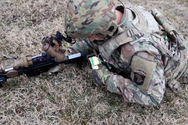 A Soldier from the 2-506, 101st Airborne Division checks his Nett Warrior end user device (EUD) during a full mission test event during a Soldier Touchpoint at Aberdeen Proving Ground, MD in February 2021.
