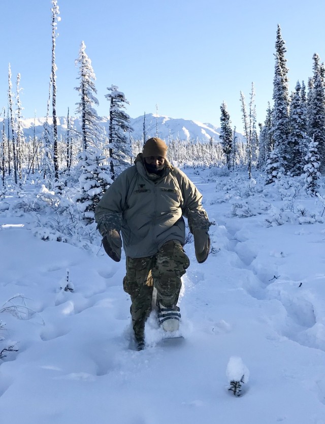 Lt. Col. Cleve Sylvester, Army Capability Manager-Army Health System, uses Army issued snowshoes to maneuver in the training area during his support of Arctic Warrior 2021 in Fort Greely, Alaska.