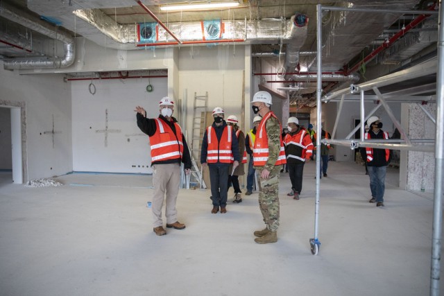 Jonathan Carr, resident engineer for the Grafenwoehr USACE office (left), USAG Bavaria garrison commander Col. Christopher Danbeck (right), and members of DoDEA visit the new Grafenwoehr Elementary School on Tower Barracks and discuss the new build&#39;s progress on Feb. 17, 2021. 