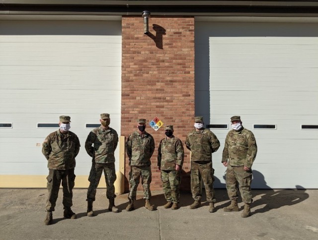 HAYS, Kan. – The Field Maintenance Shop 1 team takes a moment for a group photo outside of their maintenance bays Jan. 28, 2021. FMS 1 took first place at the National Guard Bureau for the annual Army Award for Maintenance Excellence in December...