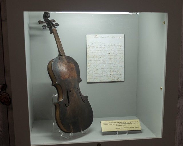 The displayed violin was made with a pocket knife in Barracks 33 of Rock Island prison and was sold in Moline, Illinois, Aug. 16, 1864. It was donated to the Rock Island Arsenal Museum by Mrs. John F. Gamble in 1964. The violin will be incorporated in the new exhibits at Rock Island Arsenal Museum.