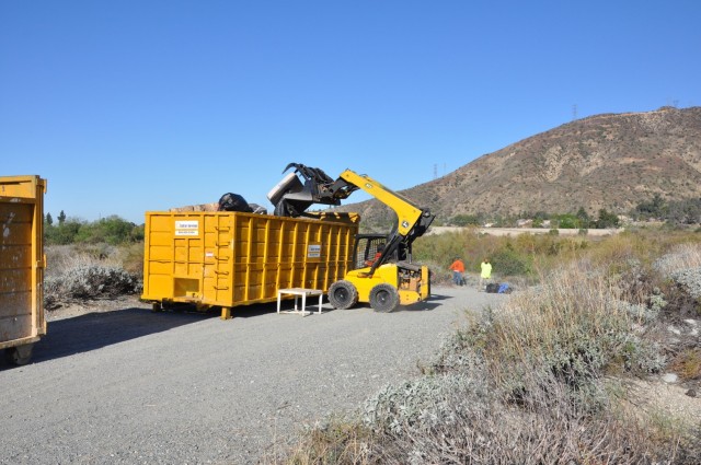 The U.S. Army Corps of Engineers Los Angeles District hauls debris left at a former homeless encampment, March 1, 2021.
