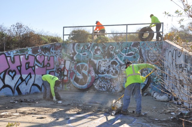 The U.S. Army Corps of Engineers Los Angeles District hauls debris left at a former homeless encampment, March 1, 2021.