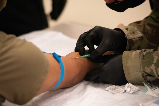 Soldiers attending the TC 8-800 MEDIC refresher Table VIII skill validation course at the Fort McCoy Medical Simulation Training Center (MSTC). Soldiers practicing their IV skills that they will be tested/validated on.