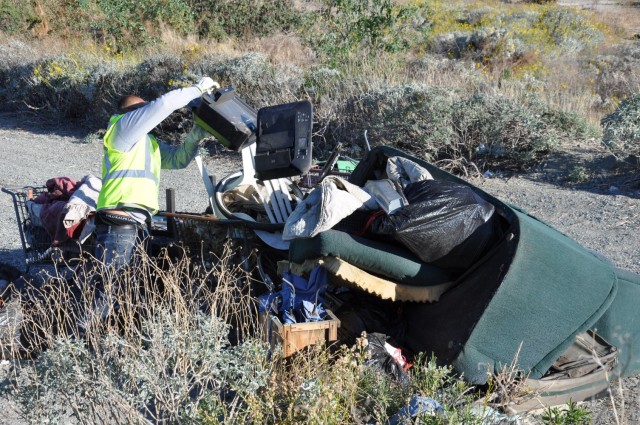 The U.S. Army Corps of Engineers Los Angeles District hauls debris left at a former homeless encampment, March 1, 2021.