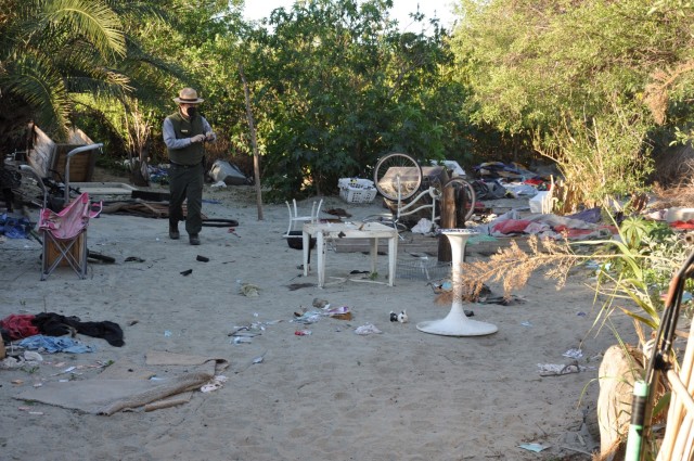 A U.S. Army Corps of Engineers Ranger documents a debris field, March 1, 2021, in the San Gabriel River near Azusa, California. The land along the river is maintained by the Corp’s LA District for flood-risk management.