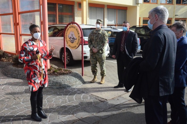 Leah Zamor, principal of Baumholder Middle and High School greets Matthias Schneider, Birkenfeld, Germany, County Commissioner during a visit to the school located in the Baumholder Military Community March 3. The two-hour visit provided the commissioner and other local German officials insight into how the Army fights COVID and protects its population in the Baumholder community, including the measures the school is taking with its faculty and students.