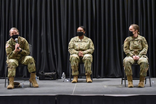 Maj. Elizabeth Sebero answers a question while Capt. Cotrena Brown-Johnson 2nd Lt. Cathryn Guzzwell look on at the MEDCoE Women’s History Month panel discussion.