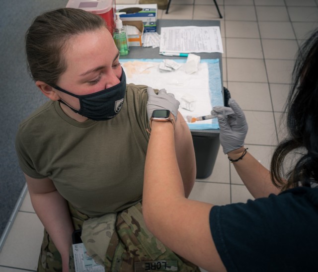 U.S. Army Spc. Alyssa Lore, a UH-60 Blackhawk crew chief with the 12th Combat Aviation Brigade, Wings of Victory, receives her second and final COVID vaccine dose on Feb. 24, 2021 in Wiesbaden, Germany. (U.S. Army photo by Maj. Robert Fellingham)