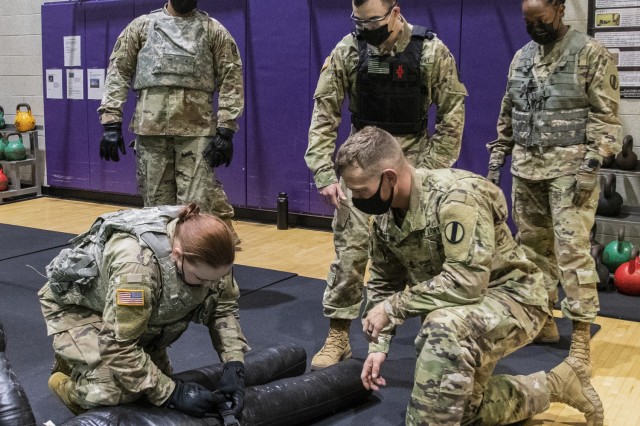 Soldiers assigned to units at Fort Eustis, Virginia, participate in realistic Army Combat Fitness Test, or ACFT, training to represent battlefield conditions, Feb. 26, 2021. Pfc. Savanna Pendergrass, 10th Transportation Battalion, applies a field...