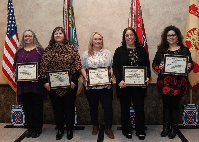 The LEADER Program Class VII graduates are: January McIntosh, Directorate of Public Work; Lavale Edwards, Fort Drum MEDDAC; Tammi Dindl, Directorate of Resource Management; Kathryn Reinsburrow, Directorate of Human Resources; and Amber Sawyer, Directorate of Emergency Services. The LEADER (Leader Enhancement and Developmental Education Requirements) program is a two-year professional development course that includes more than 200 hours of classroom and online activities – all while students maintain their regular work duties. (Photo by Glenn Wagner, Fort Drum Visual Information)