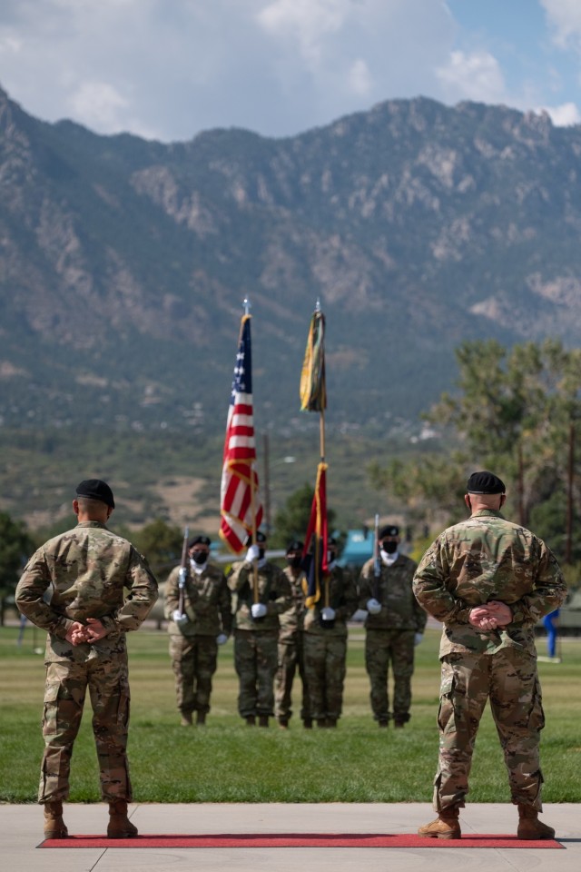 Command Sgt. Maj. Delfin Romani, left, the outgoing brigade Command Sgt. Maj.  and Command Sgt. Maj. Jerry Higley, right, the Command Sgt. Maj. for 1st Stryker Brigade Combat Team, 4th Infantry Division, stand at parade rest during the 1st SBCT change of responsibility ceremony at Fort Carson, Colorado, September 23, 2020. The ceremony was smaller in scale in order to ensure proper COVID-19 precautions were taken. (U.S. Army photo by Capt. Daniel Parker)