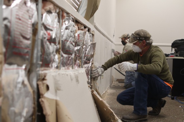 Restoration experts take apart walls that received water damage inside the School Age Services (SAS) center at Fort Sill, Oklahoma. The damage was initially contained after the storm so Soldiers and Department of the Army civilians could drop...