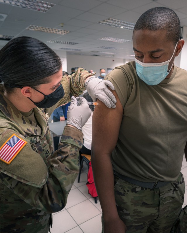 A U.S. Army Soldier from 1st Battalion, 214th Aviation Regiment, 12th Combat Aviation Brigade, receives his second and final COVID vaccine dose on Feb. 24, 2021 in Wiesbaden, Germany. (U.S. Army photo by Maj. Robert Fellingham)