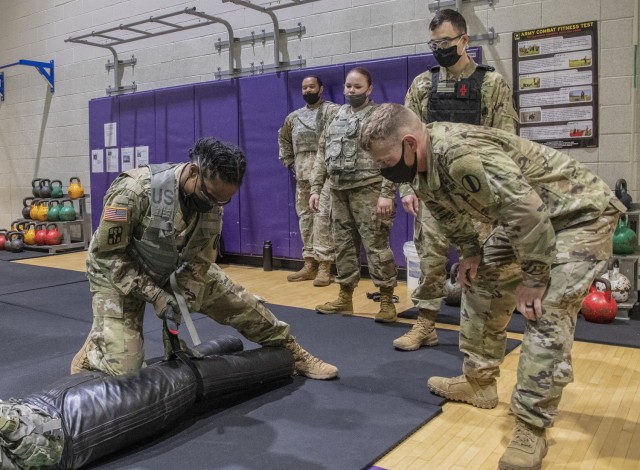 Soldiers assigned to units at Fort Eustis, Virginia, participate in realistic Army Combat Fitness Test, or ACFT, training to represent battlefield conditions, Feb. 26, 2021. Instead of the traditional 90-pound &#34;sled&#34; used for the &#34;drag&#34; portion of the &#34;sprint, drag, carry,&#34; a 140-pound dummy was used, then Soldiers applied a field tourniquet to simulate a wounded Soldier requiring immediate first aid. 