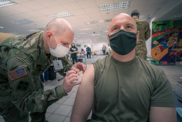 A U.S. Army Soldier from 1st Battalion, 214th Aviation Regiment, 12th Combat Aviation Brigade, receives his second and final COVID vaccine dose on Feb. 24, 2021 in Wiesbaden, Germany. (U.S. Army photo by Maj. Robert Fellingham)