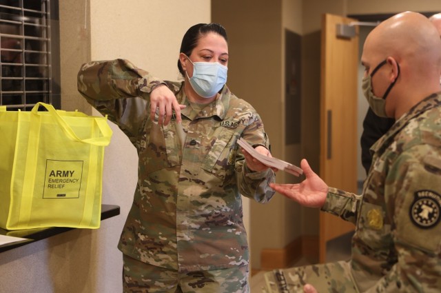 AER representative Sgt. 1st Class Natasha Hogan hands out contribution slips for Soldiers to take back to their units in hopes of receiving donations to the 2021 campaign. Funds raised go directly to service members and their Families for...
