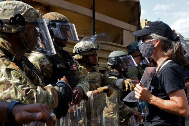 A demonstrator thanks Spc. Christopher Johnson, a military police member with the D.C. National Guard’s 273rd Military Police Company, for his service during a protest outside the White House June 3, 2020. Johnson was part of a task force that...