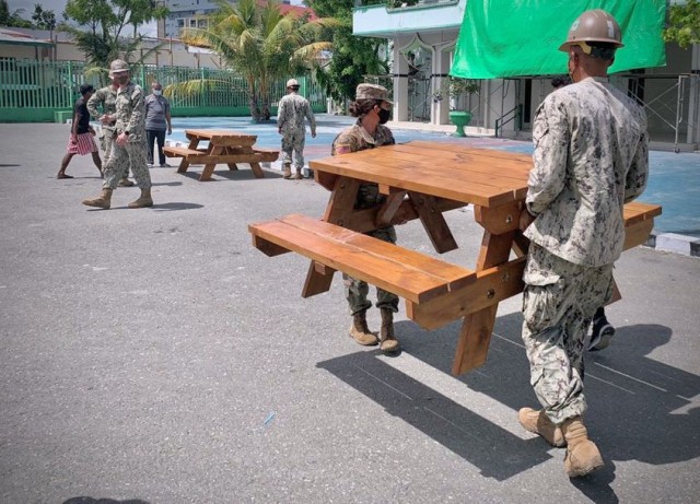 Team Timor-Leste and U.S. Navy Seabees work together to deliver picnic tables to several community organizations in Timor-Leste Jan. 5. Task Force Oceania complements the activities of the other service component commands in the USINDOPACOM area of responsibility and is committed to the Oceania region.