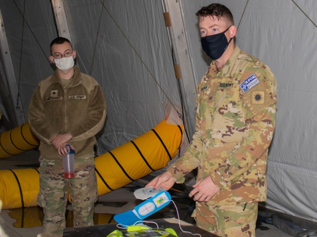 Sgt. Tye Thompson, an aviation Soldier assigned to Regional Command-East, Kosovo Force, teaches a class on the use of an automated external defibrillator during an aviation stand down at Camp Bondsteel, Kosovo, on March 6, 2021. Soldiers focused on many aspects of safety during their two-day stand down, including medical response training. (U.S. Army National Guard photo by Sgt. Jonathan Perdelwitz)