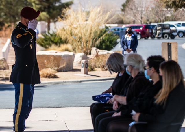 Sgt. 1st Class Michael Stroud, a platoon sergeant assigned to D Company, 2nd Battalion, 325th Airborne Infantry Regiment, 2nd Brigade Combat Team, 82nd Airborne Division renders honors during a funeral service for Pfc. Harvey Brown, a World War II...
