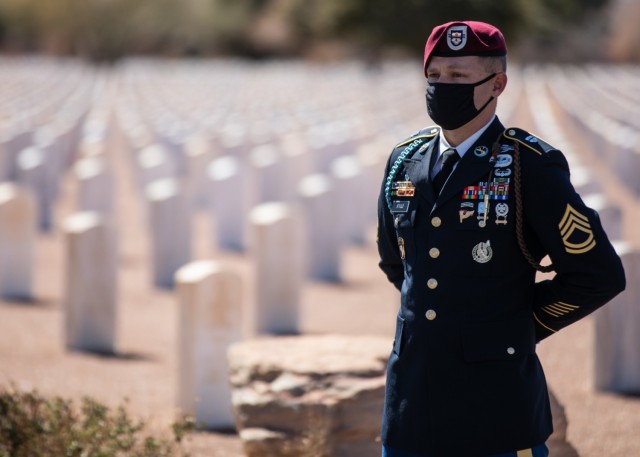 Sgt. 1st Class Michael Stroud, a platoon sergeant assigned to D Company, 2nd Battalion, 325th Airborne Infantry Regiment, 2nd Brigade Combat Team, 82nd Airborne Division, stands at parade rest during a funeral service for Pfc. Harvey Brown, a...
