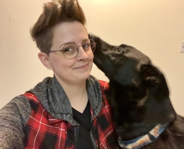 Administrative Support Assistant, Lydia Largent, at home with one of her dogs.