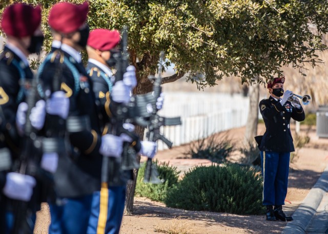 Sgt. 1st Class Nicole Daley, a trumpet player assigned to the 82nd Airborne Division Band, plays taps during a funeral service for Pfc. Harvey Brown, a World War II veteran formerly assigned to 2nd Battalion, 505th Parachute Infantry Regiment, at...