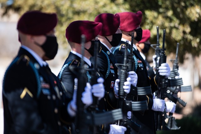 Paratroopers assigned to D Company, 2nd Battalion, 325th Airborne Infantry Regiment, 2nd Brigade Combat Team, 82nd Airborne Division, present arms during a funeral service for Pfc. Harvey Brown, a World War II veteran formerly assigned to 2nd...