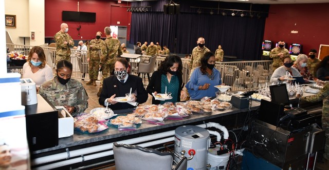 After the awards portion of the event was concluded, attendees formed a line at a breakfast buffet March 3 at the Office of the Staff Judge Advocte awards breakfast.