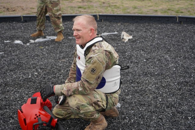 Chief Warrant Officer two Downer takes a breather before competing in the final round of the Pugile Stick fight on day three of the competition.