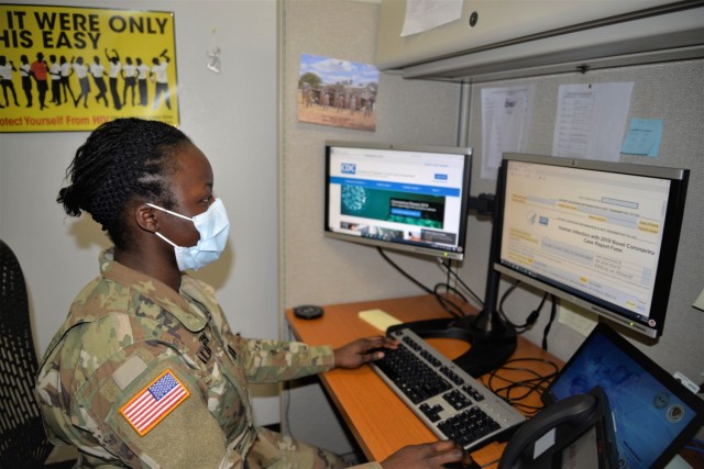 Capt. Victoria Aladeokin glances at a contact tracing form during her duties as an Army Public Health Nurse on Fort Leonard Wood, Missouri Feb. 25.