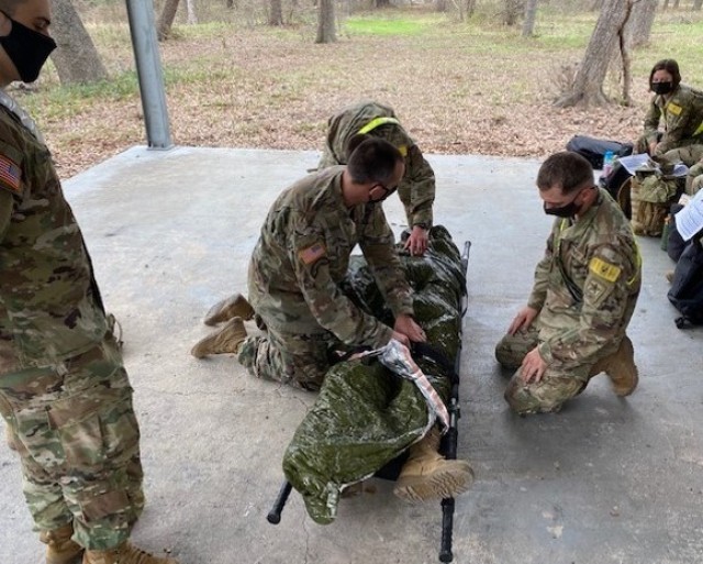 Advanced Individual Training (AIT) Soldiers assigned to the U.S. Army Medical Center of Excellence (MEDCoE) demonstrate use of the sked and litter carries during patient evacuation during Transition Training (SiTT) February 2021 at Joint Base San Antonio-Fort Sam Houston, Texas. 