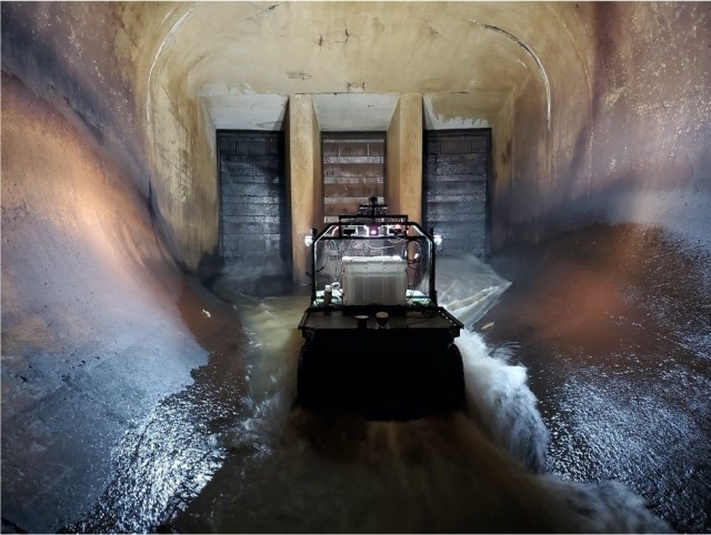 A robotic system known as Dambot operates near closure gates at Blue Mountain Dam, Arkansas in October 2020. Dambot takes the human element out of a dangerous but necessary U.S. Army Corps of Engineers (USACE) maintenance task. The cutting-edge...