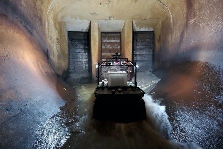 A robotic system known as Dambot operates near closure gates at Blue Mountain Dam, Arkansas in October 2020. Dambot takes the human element out of a dangerous but necessary U.S. Army Corps of Engineers (USACE) maintenance task. The cutting-edge technology has been successfully tested and stands poised to change the course of closure gate assessments, while also safeguarding USACE team members. (U.S. Army Corps of Engineers photo)