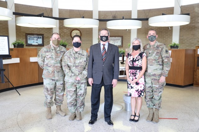 HIAWATHA, Kan. – Maj. Nick Carlson, 2nd Battalion, 130th Field Artillery Regiment administrative officer, Staff Sgt. Alicia Young, battalion medical readiness noncommissioned officer, Aimee Plankinton, battalion Soldier and Family Readiness...