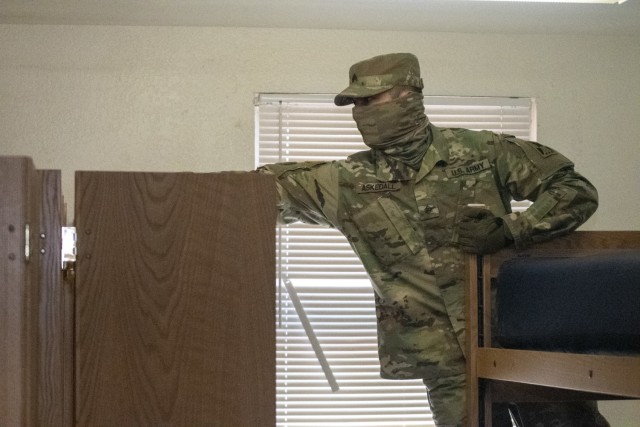 Sgt. Paul Askedall II, OR-MTC base camp noncommissioned officer, inspects the top of a wall locker during a building inspection near Camp McGregor, Fort Bliss, Texas, March 10, 2021.  The OR-MTC team is responsible for providing quality of life troop sustainment for units conducting mobilization validation certification training, and Pre-Mobilization/Exercise Training (PMET). (U.S. Army photo by Capt. Brandon Fambro)