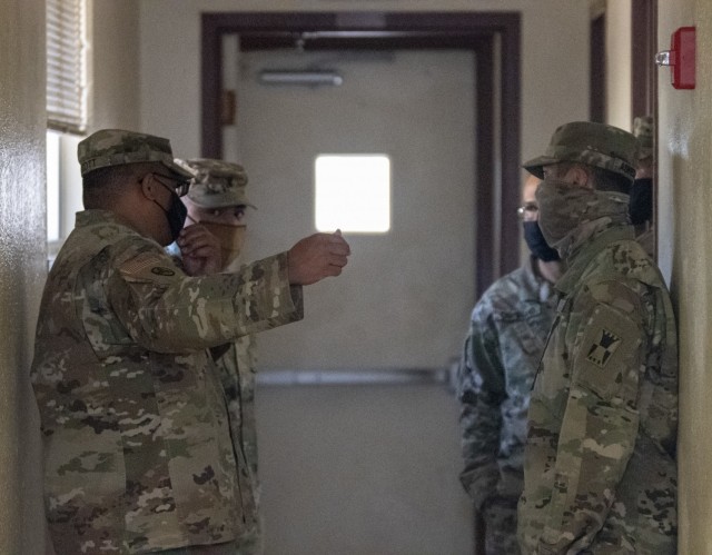 Master Sgt. Edward Scott, OR-MTC noncommissioned officer in charge, left, provides recommendations following a building inspection near Camp McGregor, Fort Bliss, Texas, March 10, 2021. The OR-MTC team is responsible for providing quality of life troop sustainment for units conducting mobilization validation certification training, and Pre-Mobilization/Exercise Training (PMET).  (U.S. Army photo by Capt. Brandon Fambro)