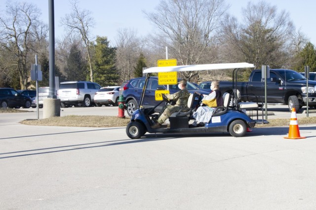 A Kentucky National Guard Soldier transports a Kentucky resident while supporting the Kentucky Horse Park COVID-19 vaccine distribution site in Lexington, Ky., April 25. The KYNG partnered with Kroger, Kentucky Emergency Management, and other...