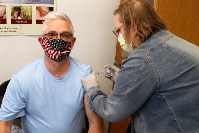 Deputy to the Garrison Commander Brad Stewart receives a second COVID-19 vaccination Feb. 26, 2021, at the Occupational Health Clinic at Fort McCoy, Wis. The clinic began providing COVID-19 shots in January 2021 and have continued the effort under a strict set of procedures that began with giving vaccinations to frontline and emergency services personnel. (U.S. Army Photo by Scott T. Sturkol, Public Affairs Office, Fort McCoy, Wis.)