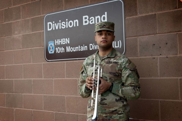 Cpl. Nicholas Smith, a musician with the 10th Mountain Division Band and recent recipient of the 2020 Finley R. Hamilton Outstanding Military Musician Award, holds his trumpet outside of the band hall on March 11, 2021, on Fort Drum, N.Y. Smith...