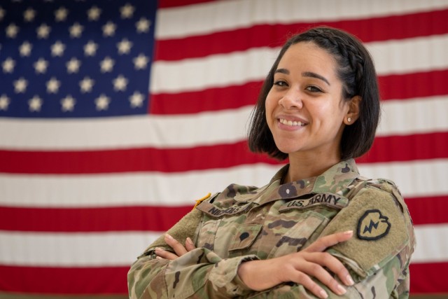 Spc. Kiala Nichols, an Aviation Operation Specialist (15P), assigned to 25th Combat Aviation Brigade, 25th Infantry Division at Wheeler Army Airfield, Hawaii, poses for a photo in front of an American flag. Nichols is wearing earrings and nail polish in her combat uniform while still maintaining professionalism after the announcement of changes to the Army Grooming Standards AR 670- 1 on Feb. 24, 2020.
(U.S. Army photo by Sgt. Sarah D. Sangster)